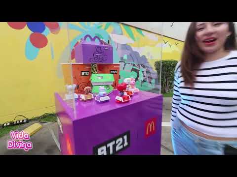 BT21 characters (Koya, RJ, Shooky, Mang, Chimmy, Tata, Cooky, Van) in a McDonald's setting, advertising a collaboration.