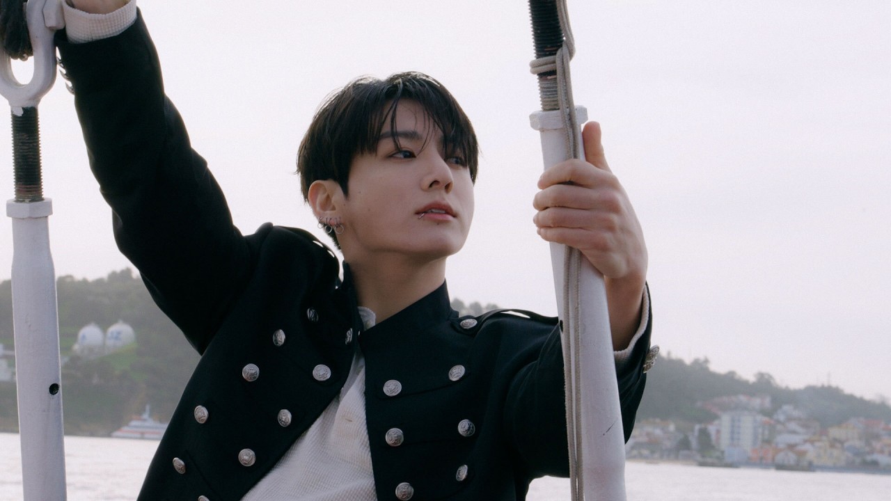 BTS 'SWIM' MV Behind the Scenes thumbnail showing members on set