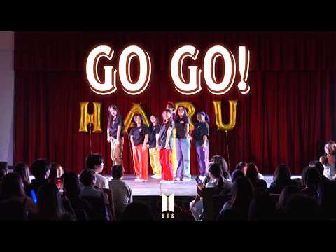 Haru Dance group performing a 'Go Go' cover with energetic poses and vibrant outfits.