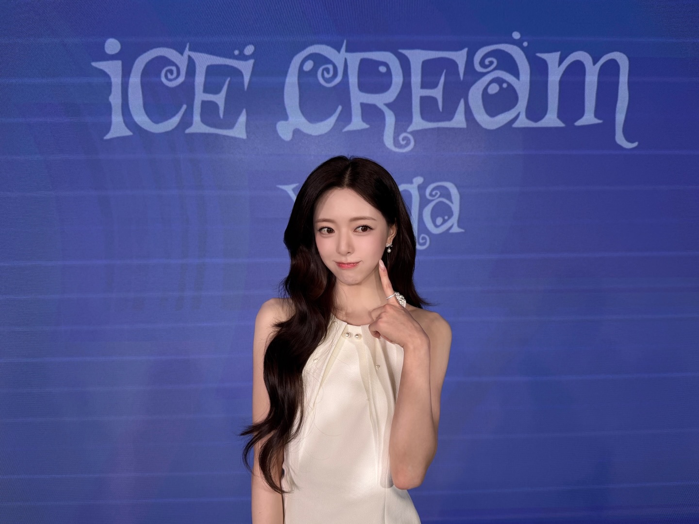 ITZY's Yuna in a playful ice cream shop concept, possibly holding an ice cream cone