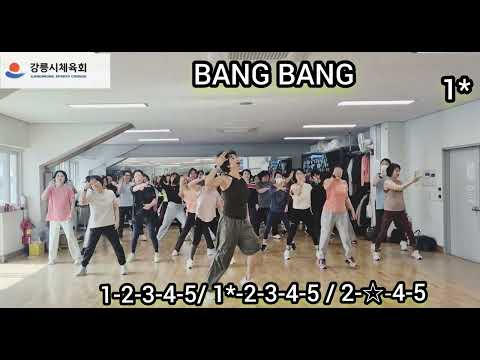 A group of people energetically performing a dance fitness routine to IVE's song.