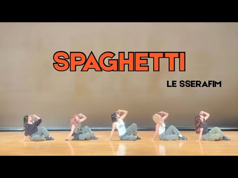 Souls Tokyo University of Foreign Studies K-POP Dance Circle members performing a dynamic dance cover of LE SSERAFIM's 'SPAGHETTI' on stage.