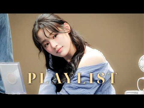 A vibrant YouTube thumbnail featuring a collage of K-Pop girl group members including NewJeans, IVE, and ILLIT with fire emojis and playlist title.