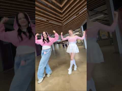 NewJeans members in a vibrant, retro-inspired setting, reminiscent of Wonder Girls' 'Tell Me' era.