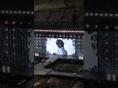 Seventeen performing on a brightly lit stage during a concert, as shown in a YouTube video thumbnail