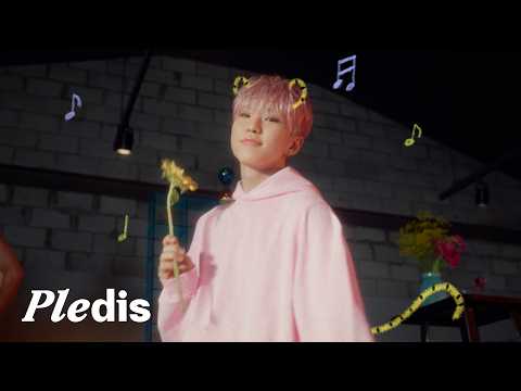 Hoshi from SEVENTEEN in his '아기자기' Official MV, smiling charmingly.