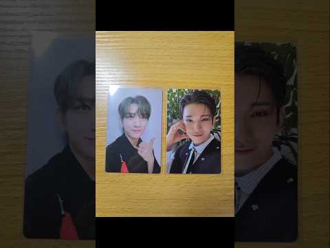 SEVENTEEN Joshua unboxing a membership photocard with an excited expression