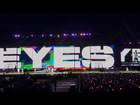 SEVENTEEN members performing on stage during an encore, with a large audience visible in the background.