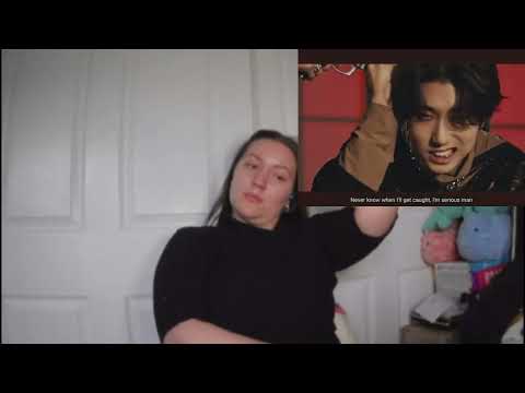 Thumbnail of a YouTube video reacting to Stray Kids' 'VENOM', showing the reactor with a cat.