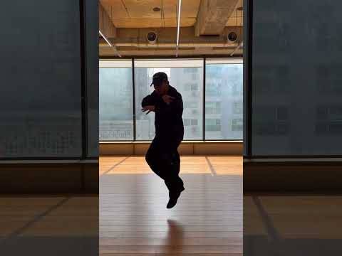 Vero from JINJO Crew performing the 'No Batidão' dance challenge in a B-boy style